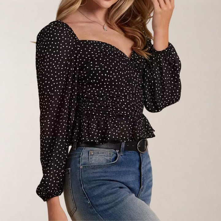 Elegante damesblouse met boothals en pofmouwen